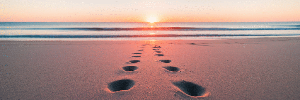 Footprints on Florida beach at sunrise