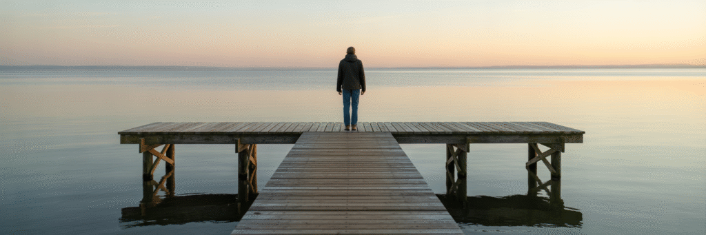 Person on a sturdy pier at sunrise.